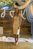 I bought this dress for my bridal shower. I was a little nervous about it at first because its not necessarily my type with how forming it is, but I received so many compliments when I tried it on and was told that it would make the perfect dress for my shower. The material is very soft, stretchy, and very comfortable even with it being tight fitting. It was the perfect length too, and the slit in the back was not too high. I ended up loving this dress, and was very happy I bought it. I got a small and it fit perfectly! - Kristen E.