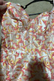 This is the ugliest dress I have ever bought in my life. It's almost laughably hideous. It looked so pretty online, but when it came in, the material is similar to a tarp or shower curtain. It's shiny, stiff, and very unflattering and cheap looking. It also has a very tacky looking corset top that you can't see in the online pictures. Worse yet, when I went online to try to return it, I was only offered an exchange for the same dress just a different size. Total waste of my money and I will never purchase from Lulus again. - Kristina M.