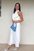 The dress looks elegant and the fabric is nice, looks like good quality fabric. Incredible price considering how good the dress looks. - Pierina G.