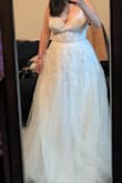 Truly a stunning dress!! I feel like a princess :) I usually wear a large with lulus dresses, but this one has a lot of give and runs a bit big. If there were medium sized dresses available, I'd probably trade it in for a medium. The only thing I don't like about it is that the boning isn't that supportive in the chest area (maybe also because it's a bit large on me) and so it gives me a bit of a strange underboob shadow, especially when sitting down. When I'm wearing a wired bra (as with the second photo) it's much better, and I'll probably try getting a nude strapless. It's also very long, will definitely need tailoring. So SO beautiful! - Angelina L.