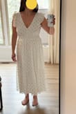This was not very cute in person. The issue may be that I ordered a M (usual size) and it's very big. Maybe a small would look better? I loved this dress on the model and was thinking to add a spray tan for my son's graduation but I'm going to be returning this one. - Monica F.