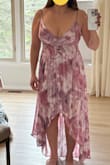 This is a very pretty dress and offered decent support for my 36Ds. I'm not wearing a bra in the pics. I pulled it up in the second pic to see what it would look like if I got it shortened because I don't love the high/low look. - Monica F.