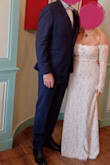 The fabric is very classy and the lace is very nice. The material is not stretchy, but it goes very smoothly around the waist and hip area. The details in the back with extra length give it a very classy look. I got lots and lots of compliments, and my husband really loved it. Thank you - Majd B.