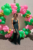I love the dress color, and it photographs beautifully as it is very sheer from the tulle material. I really like it, however, I realize I need to get it tailored a little because I don't have much of a bust, plus I am not very tall (I ordered a small).  

The bust doesn't have a built-in bra, and the back sits low, so you definitely need to add cups to the dress.  In addition, the tulle catches on the back of your shoe heel, so you may need to get it hemmed.  I think once I do that, this dress will be a favorite of mine.  One thing - be prepared to show some leg as there are slits on both sides.  So consider where you will wear this dress.  I wore it to a sorority gala for context. - Janine D.