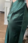 I loved this dress. I usually wear either a medium or small, and the small fits just about perfectly. I think if you have a larger bust, it might be tight in that area. I gave four stars because the seam at the zipper was rippled, and in profile it stuck out. I ended up fixing it by using double sided fashion tape to flatten the dress to the lining. - Sarah T.