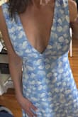 I was disappointed with how much shows with the low cut. It is much lower than pictures on site. Apparently it's not returnable for $49. Disappointing because I order a great deal from Lulus. - Lori G.