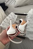 Ordered these for my elopement. Heels arrived with scuff marks and tears on the back and the bottom were dirty as if they were worn before. - Vanessa M.