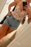 This top is so cute and girlie. I went up a size to have a little more give and length, and I'm glad I did. I do have a longish torso and it fits perfectly. - Ashley W.