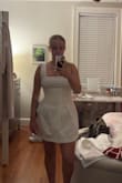 Exactly as pictured, adorable dress. I love the pearl details. Quality is high; material is a little stiff but I like it (adds shape). A little tight around the bust/the straps are a little long. Otherwise love! - Olivia S.