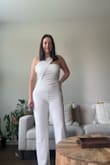 It's a casual yet elegant suit, which makes it versatile. It's exactly as seen in the photo; there are no differences between what you see and what you get. The color is true to what I expected. I bought white and was afraid it would be too transparent, but to my surprise, it had a double bottom, which adapts better to your body, helping you look more shapely while also being very comfortable. It's true to size. It's easy to put on and take off. - Saile U.