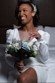 I wore this dress for my intimate ceremony and loved it. I decided to add a mesh panel to the front similar to another review I saw but left the deep V in the back. The only other alterations were hemming the dress and getting the shoulders taken up. Well worth it! - Lindsey T.