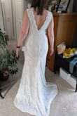 I'm 53 years old and wanted a fairly casual and inexpensive dress for my second wedding that still looked like a bridal dress. This dress fit me beautifully; had I kept it, I might have taken it in a little in the shoulders so that the waist hit me more like an empire waist, which I feel would have been more flattering. That also would have raised the hem a couple of inches, so it would not need to be hemmed. In the end, I decided to buy a long sleeved dress I found at a consignment shop and return this one, but I would have been happy with this if I hadn't found the other dress. You will not regret ordering this dress! I wear a size 12 in most clothes if that's helpful. (Ordered the XL) - Amy R.