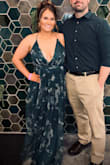 I felt stunning in this dress. I'm not one to typically wear a low cut as I never feel confident enough. [I don't have] the biggest bust but this dress with a little tan gave me everything and then some! I wore no covers/ bra and never once felt like a "slip' was going to happen.  Tulle layer is long. Like 3inches long, but I still wore sandals and didn't find myself tripping by any means. I did take pins and pin the underlayer as the slits showed a bit too much. By adding pins three inches down, I was able to wear shapewear and it pulled it off flawlessly! - McKenzie B.