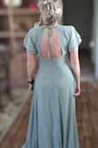 Fits true to size... beautiful color and fabric! Great dress for any age or any occasion (a bridesmaid dress that can actually be worn again). I'm 52 yrs old and was worried it would look too young for me, but I think this dress can be worn at any age. - DEBORAH M.