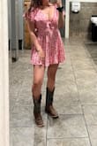 I love this romper and it has been my favorite for some time! It's very flowy and can be tailored to your chest size. Only wash it on cold, the one time it got washed on lukewarm water, it shrank. I was so disappointed and don't know if anything can fix it. Also, it never got put in the dryer, hot water was sadly enough to shrink it.  Very disappointing since this dress hasn't come back into stock that I've seen. - Anna S.