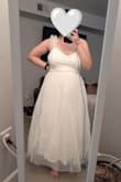 Didn't realize the skirt has crinoline, so it's quite poofy. It also smelled really bad when I got it, like fish, which I've experienced before with cheap tulle items. Probably would have washed out, but can't say for sure. - Julia C.