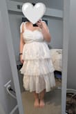 I'm 5'1" and the skirt would be a lot cuter if it were 1 tier shorter. In the pic, I had the bottom layer tucked up in the back to simulate a shorter version. Ultimately returned bc I have a rectangular body shape and the tiered skirt just makes me look wide. Also, I was concerned the material would look cheap, but I think it would look nice once steamed out (which I didn't do, so it's wrinkly in the pic) - Julia C.