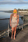 She was exactly within all of the size parameters for a Medium, so that's what we purchased. It fit perfectly and zipped up nice and easy with a hook and eye closure to secure. It also has adjustable straps. All around gorgeous dress and the price point was perfect! - Jaimie M.