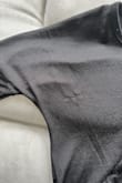 This is advertised as being a sweater but it is made of a nylon material that snagged and pilled after one wash cycle in a garment bag. I love the style and fit of this top but very disappointed in the quality of the material. Would return it if I could. - Sarah L.