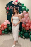 I wore this dress to my bridal shower and it was absolutely stunning! I received so many compliments - the bead and tulle flower designs make the dress so beautiful! The dress runs a little large in the bust and waist area so I had to pull it up frequently throughout the day, but other than that, the fit was amazing - a must have for brides! - Jessica D.