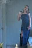 This dress is super cute, but definitely runs long. (The model is wearing the same size as me, but is way taller.) Thankfully, I got it hemmed for prom and I'm excited to wear it. Also, the split comes down lower ofc bc the model is 5'9" and wearing an XS. - Shellie M.