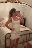 I absolutely love this dress. It's a great quality material with the cutest embroidery. The bow is top notch and not flimsy like some dresses. It's a little hard to zip up the side past the waist, but the zipper gets more used to the path and I was able to zip up by myself the second time. The top in the front is a bit gappy for a small chest, so will probably have to get it altered since I love it so much besides that. It's a great length, and can squat down without showing anything. Also, strapless bra or a regular bra will most likely show in the back above the bow. Came a little wrinkly but should come out with steamer. - Elizabeth M.