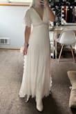 I ordered this dress for engagement photos. Ended up choosing a different dress but saving it for honeymoon or other bridal event. It's light weight, not too long for my height. The little bit of lace is beautiful and adds to dress. - Brianna P.