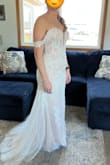 This dress is perfect for a bride on a budget or not! The quality is so nice that you wouldn't be able to guess the price. I like that the fabric is light and airy, it will make for a great summer wedding dress. The fabric fits nicely but not necessarily tight. All the detail is really nice. - Elizabeth N.