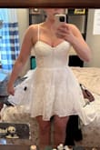 Love this dress. It's elegant and well made. Flirty and youthful just enough. It's a tad too tight but a Large tends to be too big for me. I'm banking on my usual winter weight to drop just in time for my August wedding. haha - Mary L.