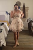 I absolutely love this dress. It is so cute, darling, stunning, flirty, fun, my friend called it whimsical. As a short girlie, it is the perfect length. I love the structural design of the dress that makes it so fun. The material doesn't stretch, but the cut of the dress makes it so that doesn't matter. I have a large bust and a medium waist/hips, and I don't feel restricted by this material. Get the dress, it is adorable and sexy at the same time. - Krisell C.