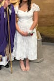 This dress is PERFECT! It fits true to size and is made absolutely gorgeous! For the price, I am amazed at the detail. My daughter received so many compliments. A family also said that it is the quality of something they would buy when they visit Italy! And that my daughter looked beautiful. - Allison H.