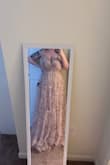Had to return. The dress was beautiful, great material and fit well everywhere else. Very long, I'm 5'3, which I don't feel is short, and it was dragging on the floor. I also have a very large bust, and the description did not say it wasn't big bust friendly like some other dresses I viewed did. After trying it on with an adhesive bra, I felt like if I moved or bent down, it was too risky that my breast would literally fall out of one of the sides, top or even the bottom. Beautiful dress overall, but if you are a large cup size, I'd refrain from purchasing this one. - Karisa V.