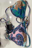 It's a nice bikini top and it is good quality, but I wish the description on the item would warn you that the pattern can differ for each item, in my case one triangle was the pretty pink pattern that the model is wearing and the other triangle was almost completely green in color with the paisley pattern. Still beautiful but not what I was expecting - Vicente A.