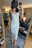 I liked the dress overall, but the plastic pieces of the corset were popping up through the fabric. Didn't include pics of that because I thought pics of the dress on would be more helpful. Really loved the back of this dress, but ultimately returned. - Maria R.