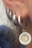 I love these earrings! I added them to my stack and have gotten so many compliments. They don't tarnish either so my ears don't bother me at all. Definitely buy these!! - Annabelle P.