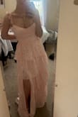 I LOVEEEE this dress so much I think it's the cutest thing however, I completely measured myself and read the chart which showed I was a size small but then once I tried it on it was a little too big even with the straps fully tightened (specifically around bust and waist) so I'm ordering it in a size down. The material is a little cheap feeling. But the color, pattern, style, and adjustable straps are perfect! Can't wait to wear this to prom. - Emma N.