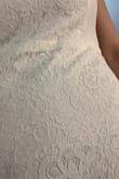 Beautiful dress that looks better in person than in the photo. Detailing is lovely. This was large on my waist but perfect on my hips. Good stretch. Could be altered to fit better, but I ultimately went with a more structured dress. - Beverly M.