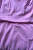 Picture is in bad lighting, so it isn't true to color. Makes a bulge at the seam between the bust and waist as if there is too much fabric. It's a beautiful dress, but sadly, this is a dealbreaker for me.

I usually wear an S, but I sized up to an M according to other reviews. - Kush A.