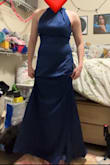 Generally a pretty dress, waistline was very flattering. Stitching along neckline and several other places was wonky. Fabric felt cheap and plastic-y, and seemed like it would be very sticky in warm weather. Was long even with heels  (I'm 5'6"). Not awful but slightly disappointing for the price. - Rachel F.
