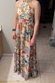 The dress fit well and was lovely. There was a seam that went straight down the middle of the front, which wasn't my favorite, but the main reason I returned is because the paisley didn't do much for my skin tone and coloring. I would need to be tanner like the model to pull this off. The length was great, and like a lot of the reviews have stated, the zipper didn't seem like it was going to perform well. The dress zipped open just fine, but it wouldn't close while on without help from my husband. - Valerie T.