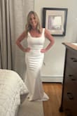 I read all the reviews on this dress before I decided to order it. Was happy to hear that most women loved it, so felt comfortable ordering from Lulus. After trying on 5 other dresses, this was the top choice. Material is stretchy, and loved how it fit my figure. I wanted simple, and this is it. Love the scoop back and the beautiful bow. Straps are slightly big, but nothing alterations can't fix. The length with heels will still have to be taken up just slightly. The only other idea I have is purchasing a bridal belt and having it sewn on the front seam. It will dress it up a little bit more and hide the seam line. Overall dress fits perfectly! Don't hesitate on ordering! Very happy with this dress! - Pamela O.