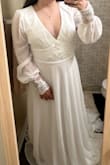 My wedding dress! Love that it's a nice quality for the price. I'm short so the top was a bit low, but I'm not sure if I will get alterations or leave it as is. I love how flowy the skirt is, but it's long on me since I'm 5'0. With some easy alterations it will be perfect! Love the beaded flower design and the sleeves! - Lauren J.