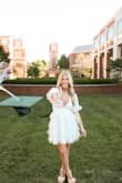 This dress looked adorable on my daughter for her college graduation. The ruffles give the perfect girlie look to pair with a cap and gown. - April W.