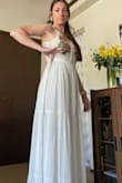 If you're between a S and M, order the S. My waist measures 28.5 inches right now, but this dress is LOOSE. The M waistband is 16 in across, so 32 all the way around. In the bust it's alright (sticky bra), I'm 32D (almost DD). I'll need to take this in at the waist or exchange for a S. Overall, the dress itself is really pretty, the fabric feels nice and light, but not see through. Lined nicely. - Sarah O.