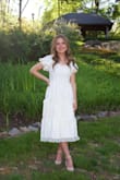 I love this dress!!! I ordered it for my graduation photos because I wanted a white dress and one that was very flattering. It fits true to size and is now one of my favorite dresses! - Haven A.