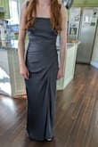 It is just as pictured. I did need to steam it to get the wrinkles out from shipping. She was beautiful in this dress. - Katy M.