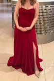 I love this dress and I'm glad I bought it - it looks gorgeous on and I got tons of compliments on it. That said, I'm on the shorter side - 5' 4" - and it does not hit me where it hits this model above the ground. It pools on the floor for a few inches, even when I wore short heels with it. I'm going to get it altered to shorten the overall length by 4-5 inches and raise the slit up my leg a little more. I should also note this dress is pretty heavy (maybe 2 pounds, it has 2 layers of fabric) so it's really more like a GOWN than a DRESS. Aside from the LENGTH, the FIT size is exactly what I expected. And it really is lovely, so I'm willing to get the length shortened to keep wearing it. - Katy M.