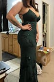 Love this dress. It's very classy but sexy. The color is a deep green and is just gorgeous. It's also very comfortable and supports my large bust which is very hard to do with an open back like this. Buy it! - Alexandra S.