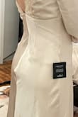 Zipper buckles on the back, sleeves fall off, back too open to wear a bra, not made for a small chest. Cheaply made, disappointing. - Natalie L.