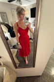 The Never a Dull Moment Bright Red Tie-Strap Pleated Midi Dress is the perfect blend of simplicity and beauty. The design is minimal but makes a bold statement with its vibrant red color. It hangs beautifully on the body; so flattering on any shape, and the lightweight fabric feels soft and breezy, perfect for warm days or layering up on cooler nights.
The tie-straps are a lovely touch; not only do they add charm, but they make the dress easily adjustable for the perfect fit. I love how effortless it is to wear, and yet it looks so polished. Whether you're heading to brunch, a date night, or even a casual wedding, this dress fits the moment. I've already recommended it to friends, and I'd absolutely buy it again in other colors if available! - Corrie L.
